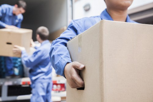 Removals team protecting furniture during a safe move in Woking