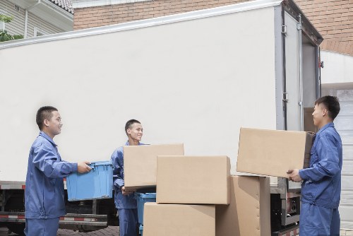 Loading furniture into a removal van for a Woking house move