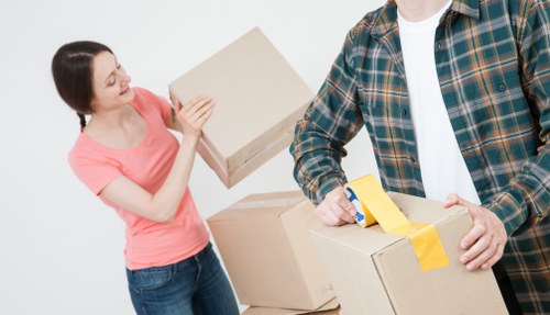 Boxes and furniture arranged for a house removal quote