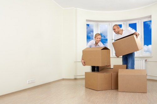 Packed boxes and careful loading for a local home removal in Woking