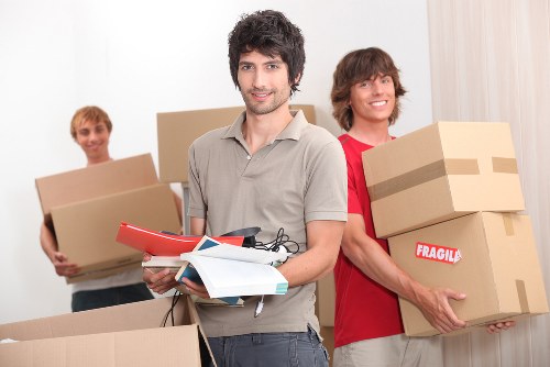 Packed moving boxes and furniture ready for a Woking home removal