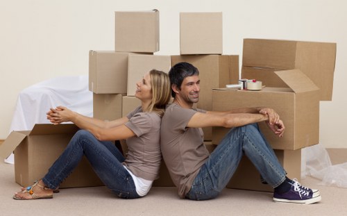 Professional movers loading furniture for a local Woking removal