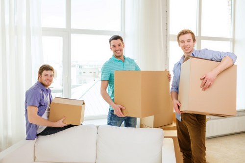 Boxes and furniture being loaded into a removal van