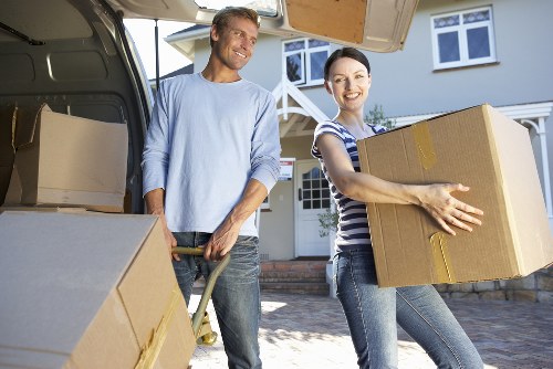 Packed moving boxes and furniture inside a removals van