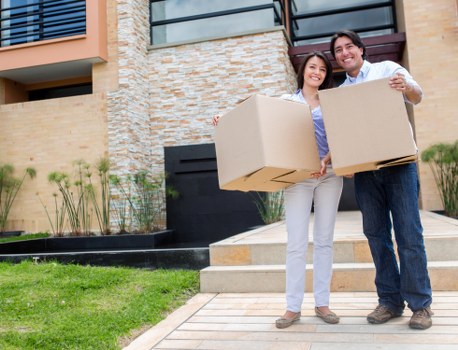 Removal van transporting household items across Woking